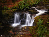 Long exposure shot of Torc creek with small waterfall in Kerry mountains, Ireland