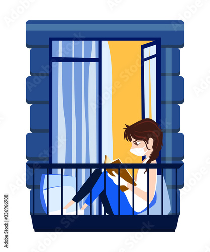 Girl reading a book while sitting at the balcony at home in quarantine. She wears white medical face mask and gloves being isolated at home. She reads an interesting book spending great time.