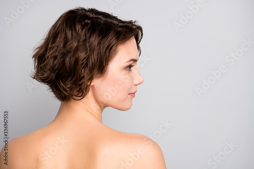 Closeup profile rear behind view photo of attractive beautiful naked lady bob short hairstyle look empty space sensual aesthetic beauty isolated grey color background photo