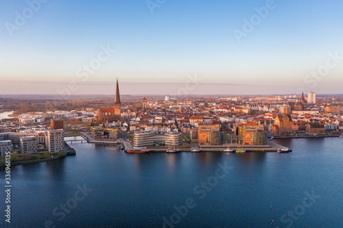 panorama of the city of rostock - aerial view over the river warnow, skyline during sunrise