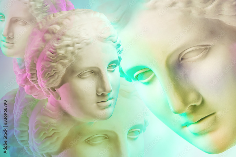 Statue of Venus de Milo. Creative concept colorful neon image with ancient greek sculpture Venus or Aphrodite head. Webpunk, vaporwave and surreal art style. Pink and green duotone effects.