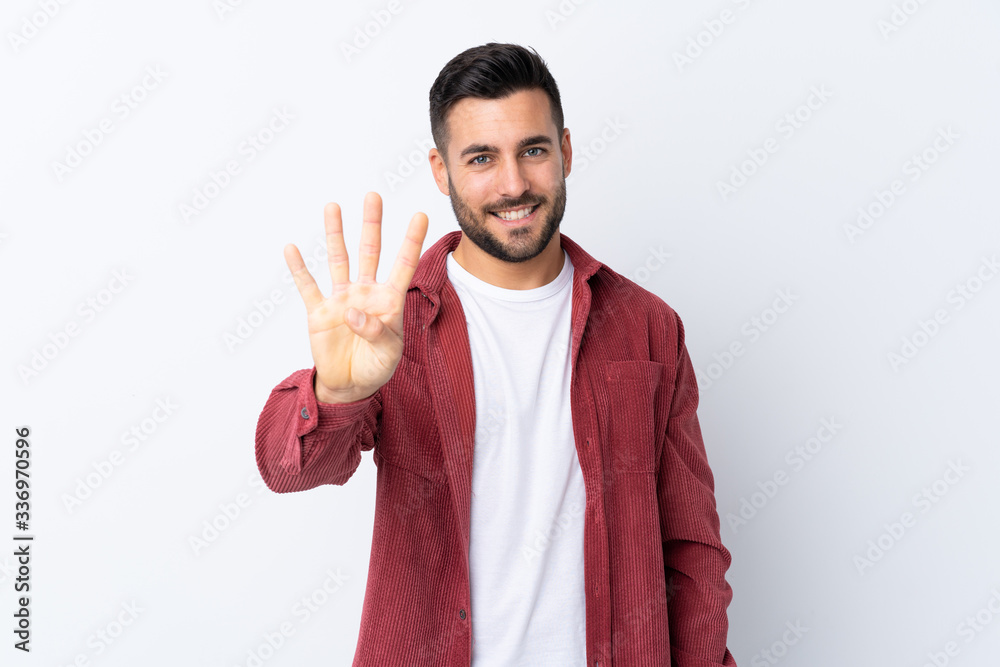 Young handsome man with beard wearing a corduroy jacket over isolated white background happy and counting four with fingers Young handsome man with beard wearing a corduroy jacket over isolated white background happy and counting four with fingers