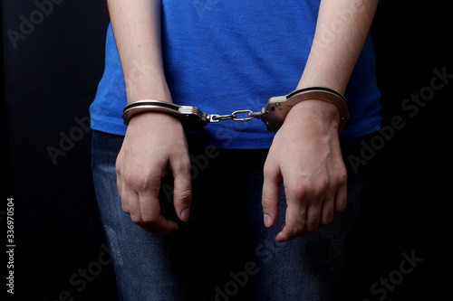 men and women cuffed hands together