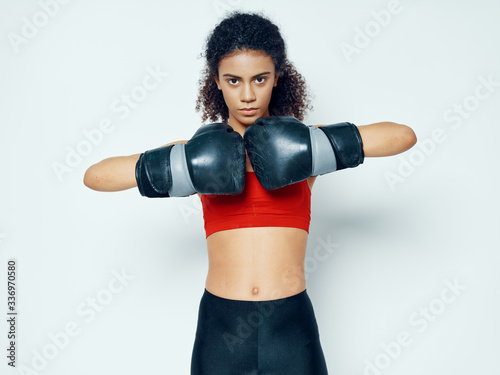 young woman with boxing gloves © SHOTPRIME STUDIO
