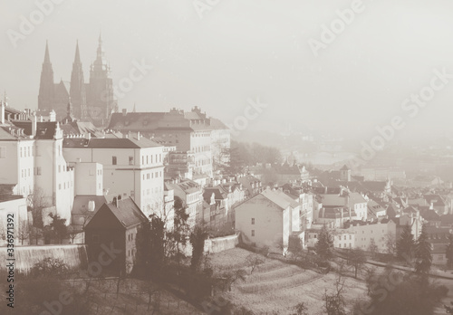 Romantic view on Praga from above. Sepia toned card in vintage retro style © Alya