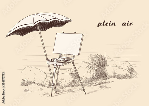 
Plein Air. Vintage image of the french style easel with  canvas,  palette, brush and an umbrella on the river bank. Painting in the open air.  