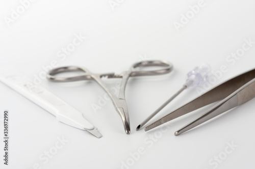 Close up of medical instruments on white background. Instruments is used for cannulation of central venous catheter in ICU in hospital.