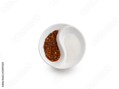 Cayenne pepper with sugar in bowl on isolated white background