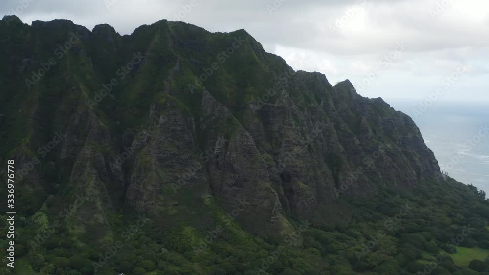 The best and most beautiful mountains in world. Top view of the mountain in Hawaii. Hawaii Vacation. Nice mountains, jurassic park mountains, tall palm trees. Turquoise sea water vacation The best and most beautiful mountains in world. Top view of the mountain in Hawaii. Hawaii Vacation. Nice mountains, jurassic park mountains, tall palm trees. Turquoise sea water vacation
