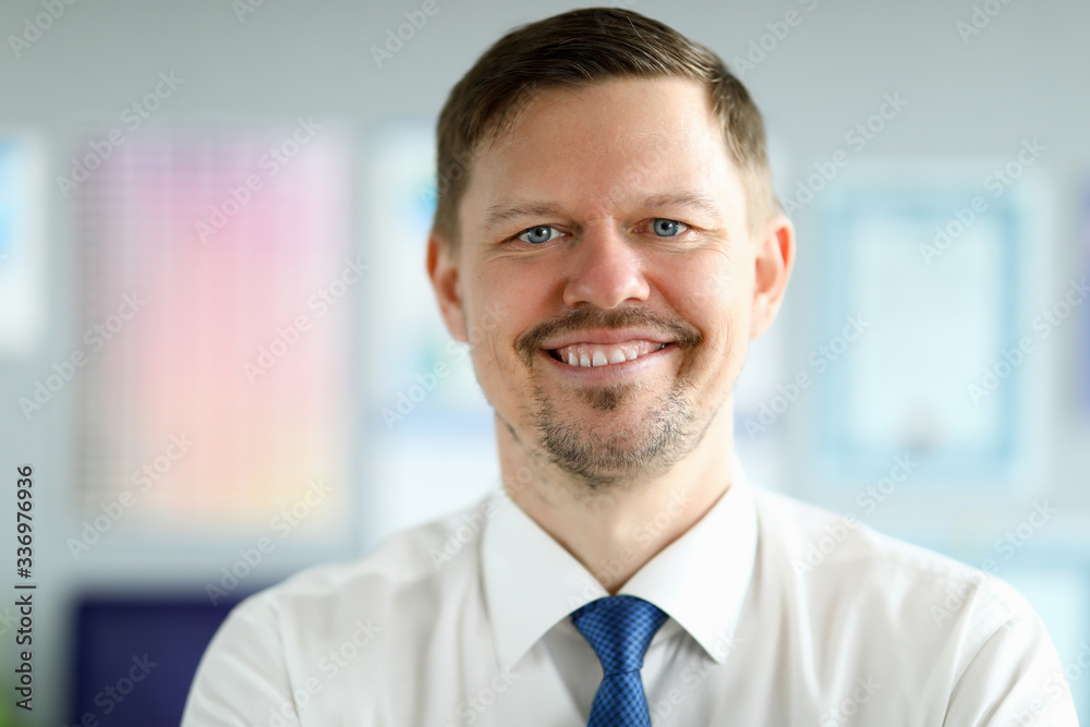 Caucasian adult smiling businessman office portrait. Business online education concept Caucasian adult smiling businessman office portrait. Business online education concept