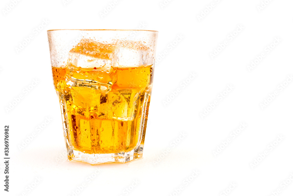 Glass of scotch whiskey and ice over white background. Glass of scotch whiskey and ice over white background.