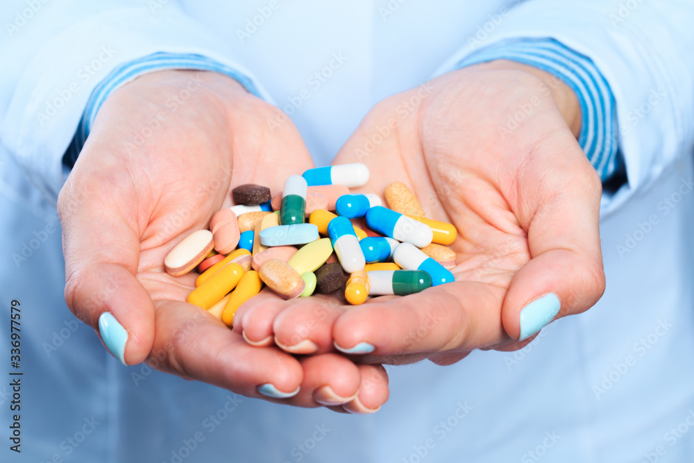 Doctor hand holding pills close up view - Image Doctor hand holding pills close up view - Image