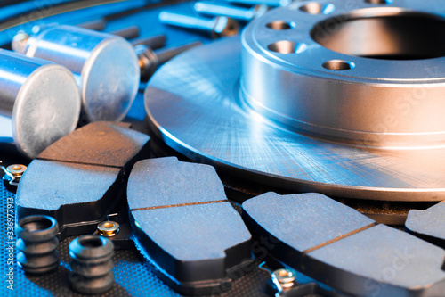 brake parts on dark background  brake pads, disc, brake hose, guides, cylinders - Image