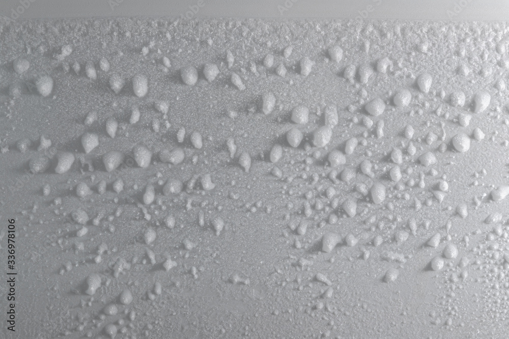 Ice coating on the back wall. Inside the refrigerator.