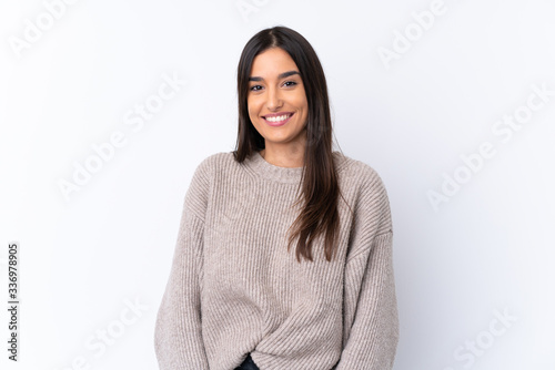 Fototapete Young brunette woman over isolated white background laughing