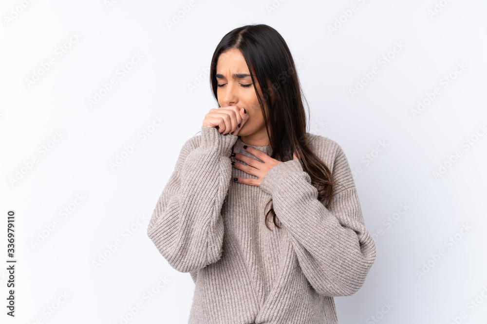 Young brunette woman over isolated white background is suffering with cough and feeling bad Young brunette woman over isolated white background is suffering with cough and feeling bad