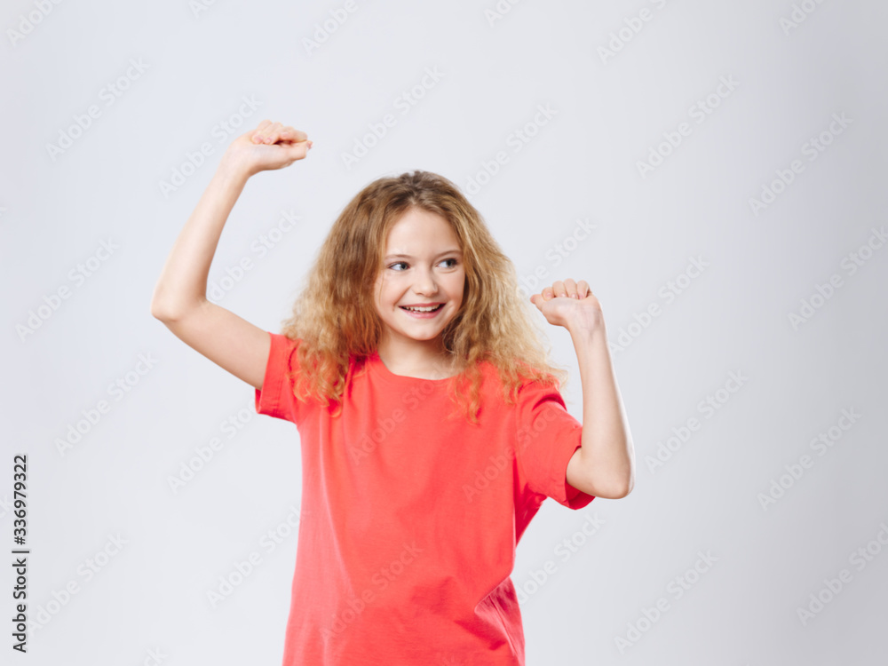 little girl with hands up and smiling little girl with hands up and smiling