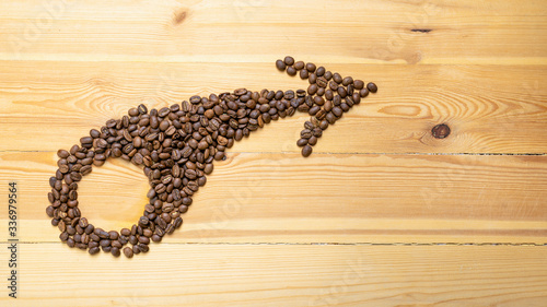 The arrow that shows you the rise made of roasted coffee beans that shows you the increase in motivation