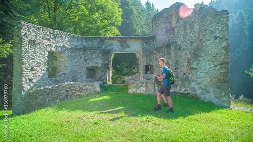 Tourist Hiker Couple Explore Ancient Ruins In Vuzenica, Slovenia photo