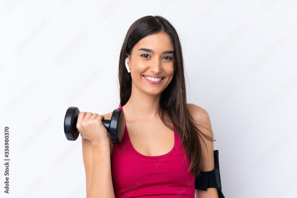 Young sport brunette woman over isolated white background making weightlifting Young sport brunette woman over isolated white background making weightlifting