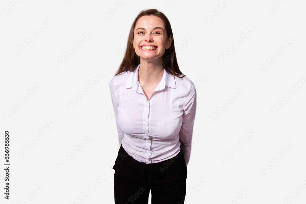 Happy girl posing with broadly smile, showing white straight teeth. Crazy smile Happy girl posing with broadly smile, showing white straight teeth. Crazy smile