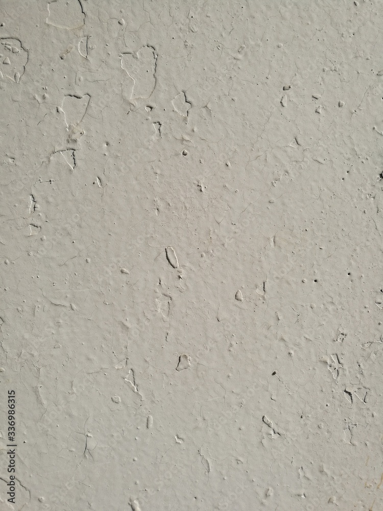 Old crackled white painted concrete wall Old crackled white painted concrete wall