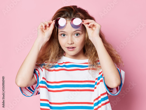 Beautiful little girl curly hair fashion clothes glasses studio model © SHOTPRIME STUDIO
