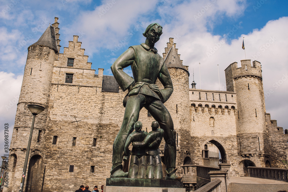 Statue of Lange Wapper in front of the castle in Antwerpen. Lange Wapper is a legend about a giant who irritates people, children, drunkards, and loose women.