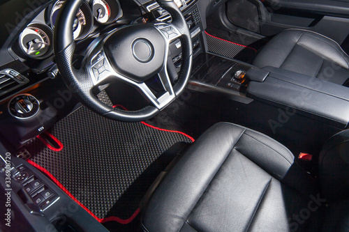 Modern interior of a car, steering wheel © berlizov