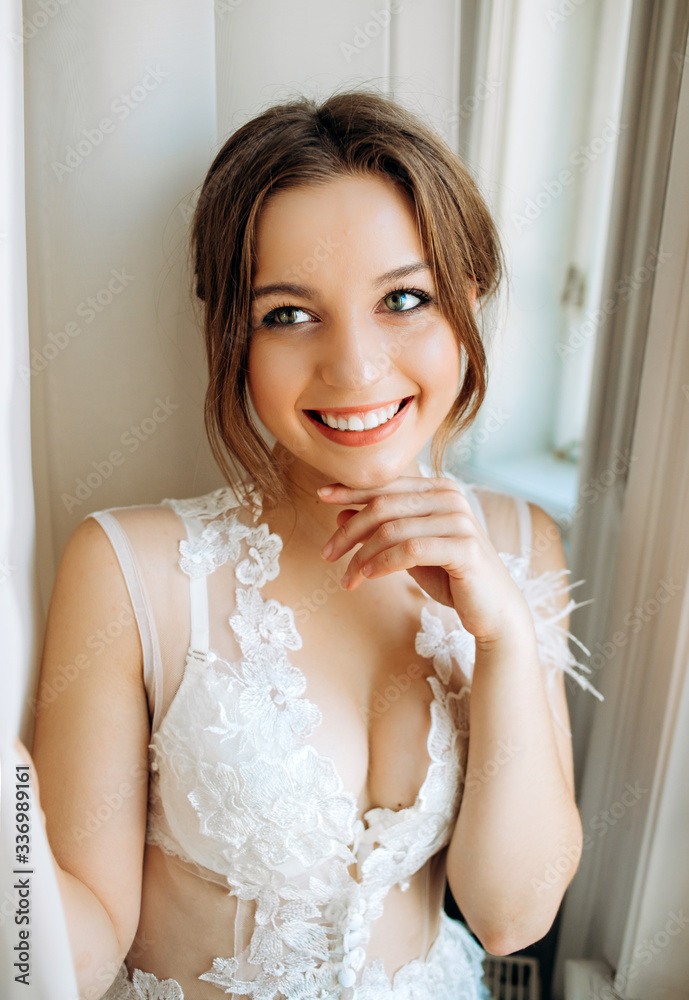 Portrait of cute bride on tulle background Portrait of cute bride on tulle background