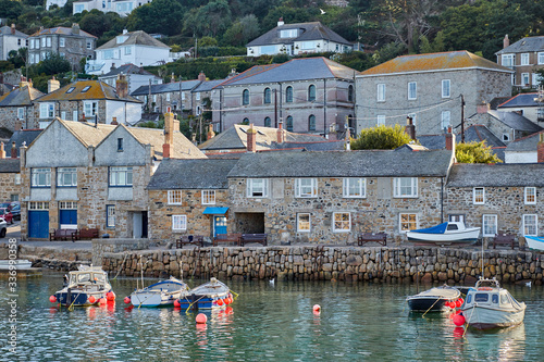 View of the coastal town harbour of Mousehole, Cornwall photo