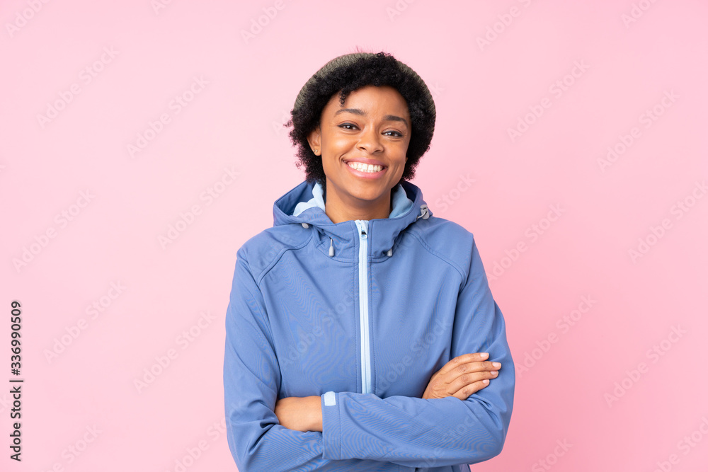African american woman with winter hat over isolated pink background laughing African american woman with winter hat over isolated pink background laughing