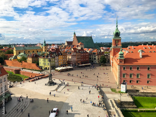 Warsaw, Poland - 21/ 06/ 2019: Beautiful multi-colored houses in the old town in Warsaw. The central streets of the historic center of Warsaw. Castle Square View from the Town Hall.