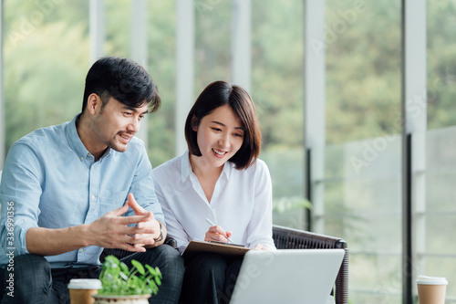 Young Asian business man and woman