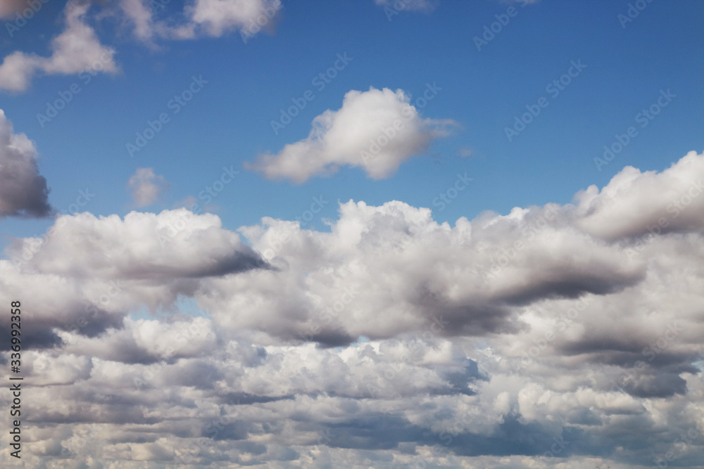 Fototapeta premium Blue sky background with large clouds. Blue sky with fluffy white clouds