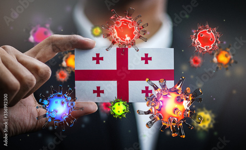 Corona Virus Around Georgia Flag. Concept Pandemic Outbreak in Country photo