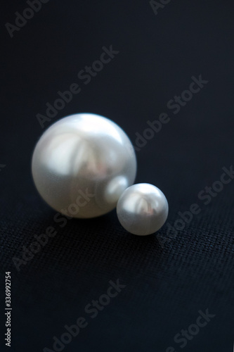 Pearls close-up. Macro pearls. Pearls on a black background.