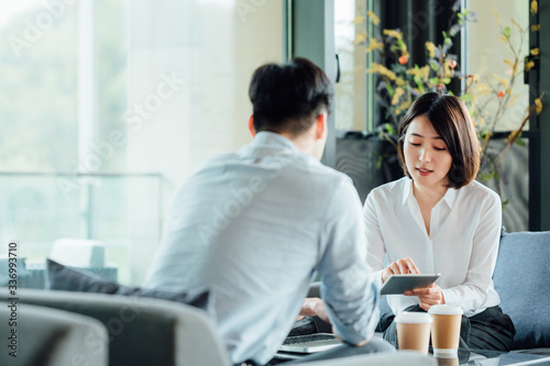 Young Asian business man and woman