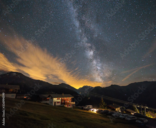 the milky way above the village in the alps, the starry sky in switzerland