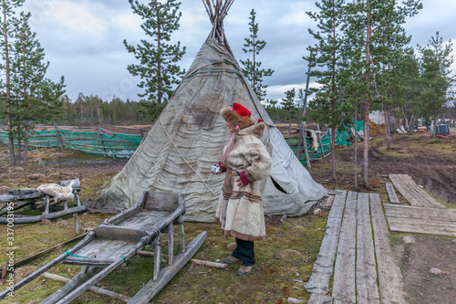 female saami, sami in national dress, saami village on the Kola Peninsula, Russia.
