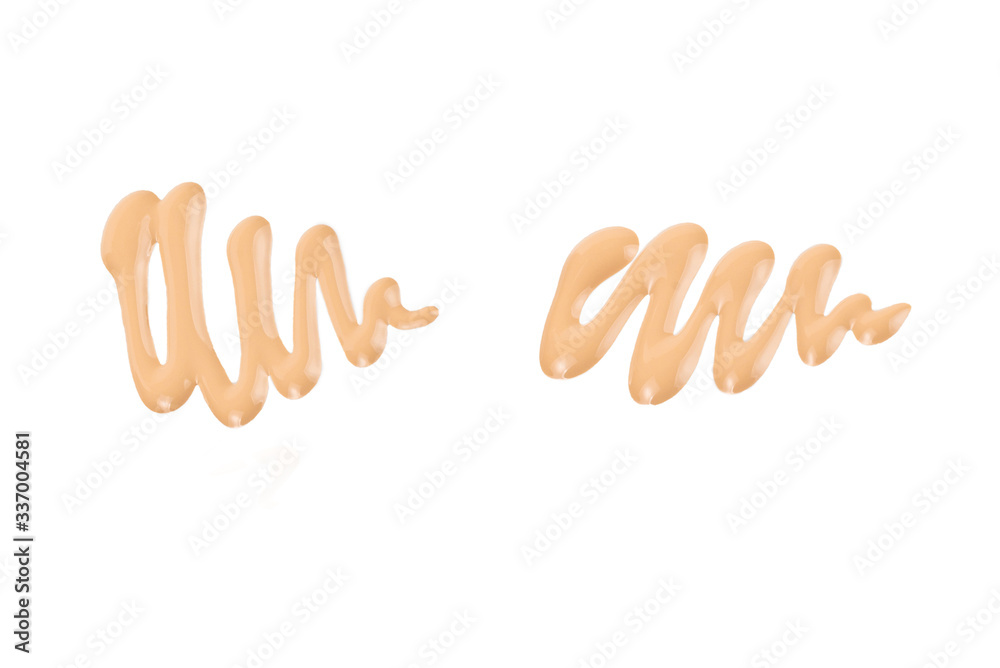 Liquid foundation swatch isolated on white background. Close Up of makeup cream sample. Liquid foundation swatch isolated on white background. Close Up of makeup cream sample.