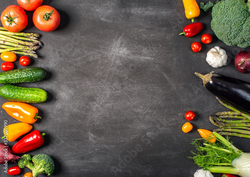 Exposition of fresh organic vegetables on black table. tomato, pepper, broccoli, onion, garlic, cucumber,  eggplant, black Eyed Peas, ecological bag.