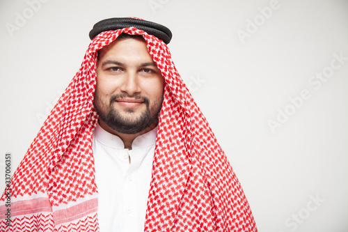 Stampa su tela Arab sheikh wearing headscarf portrait isolated on white background