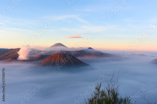 Panoramic view of Mount Bromo covered by morning fog at sunrise  East Java  Indonesia.
