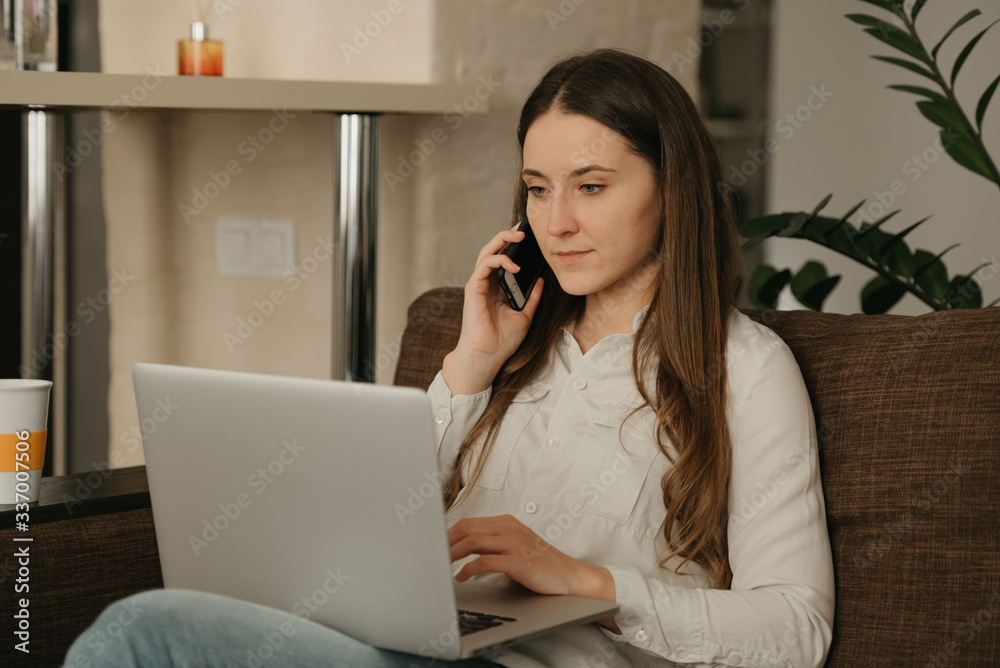 Remote work. A caucasian woman studying remotely on her laptop. A lady with long hair calling from home. Remote work. A caucasian woman studying remotely on her laptop. A lady with long hair calling from home.