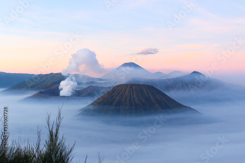 Panoramic view of Mount Bromo covered by morning fog at sunrise, East Java, Indonesia.