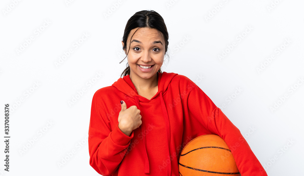Young woman playing basketball over isolated white background with surprise facial expression Young woman playing basketball over isolated white background with surprise facial expression