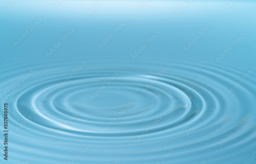 Waves on the surface of the water from a collision. Drop of water drop to the surface.