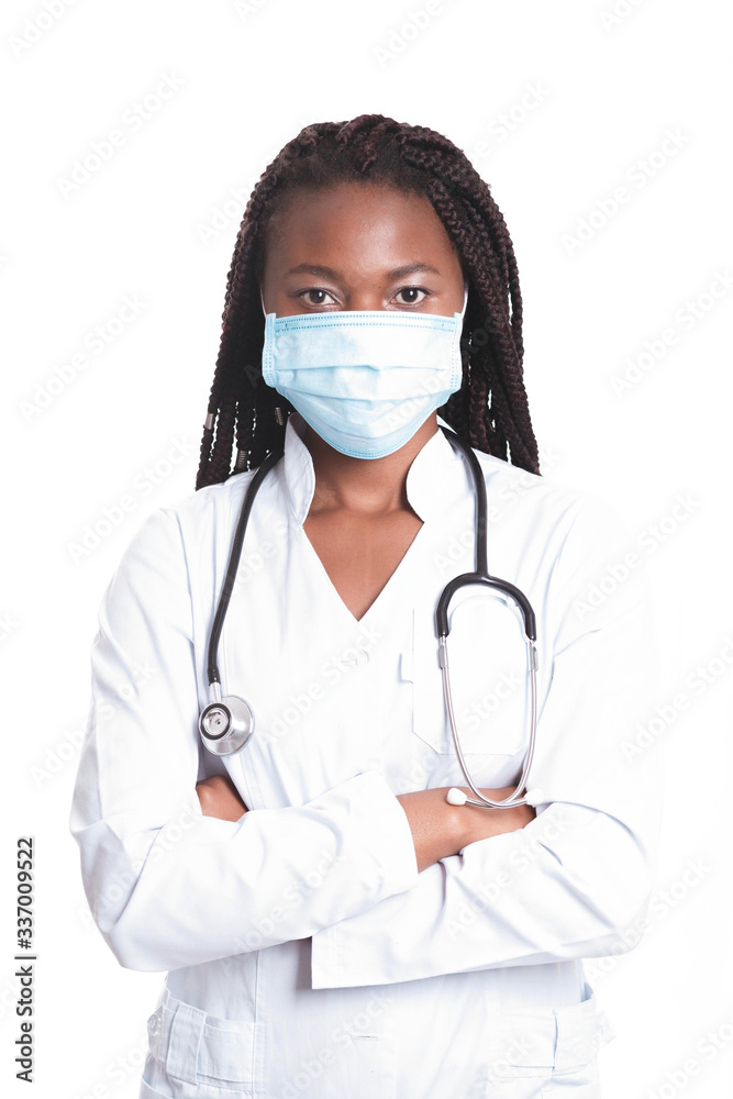 Female american african doctor, nurse woman wearing medical coat with stethoscope and mask. Happy excited for success medical worker posing on light background. Pandemia concept, covid 19 Female american african doctor, nurse woman wearing medical coat with stethoscope and mask. Happy excited for success medical worker posing on light background. Pandemia concept, covid 19
