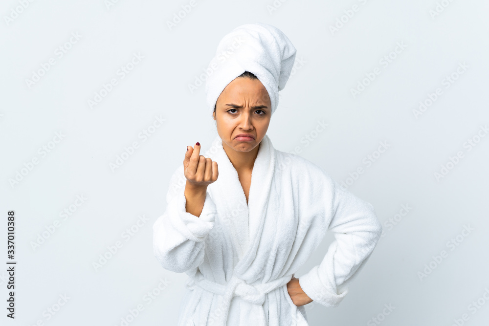 Young woman in bathrobe over isolated white background making Italian gesture Young woman in bathrobe over isolated white background making Italian gesture
